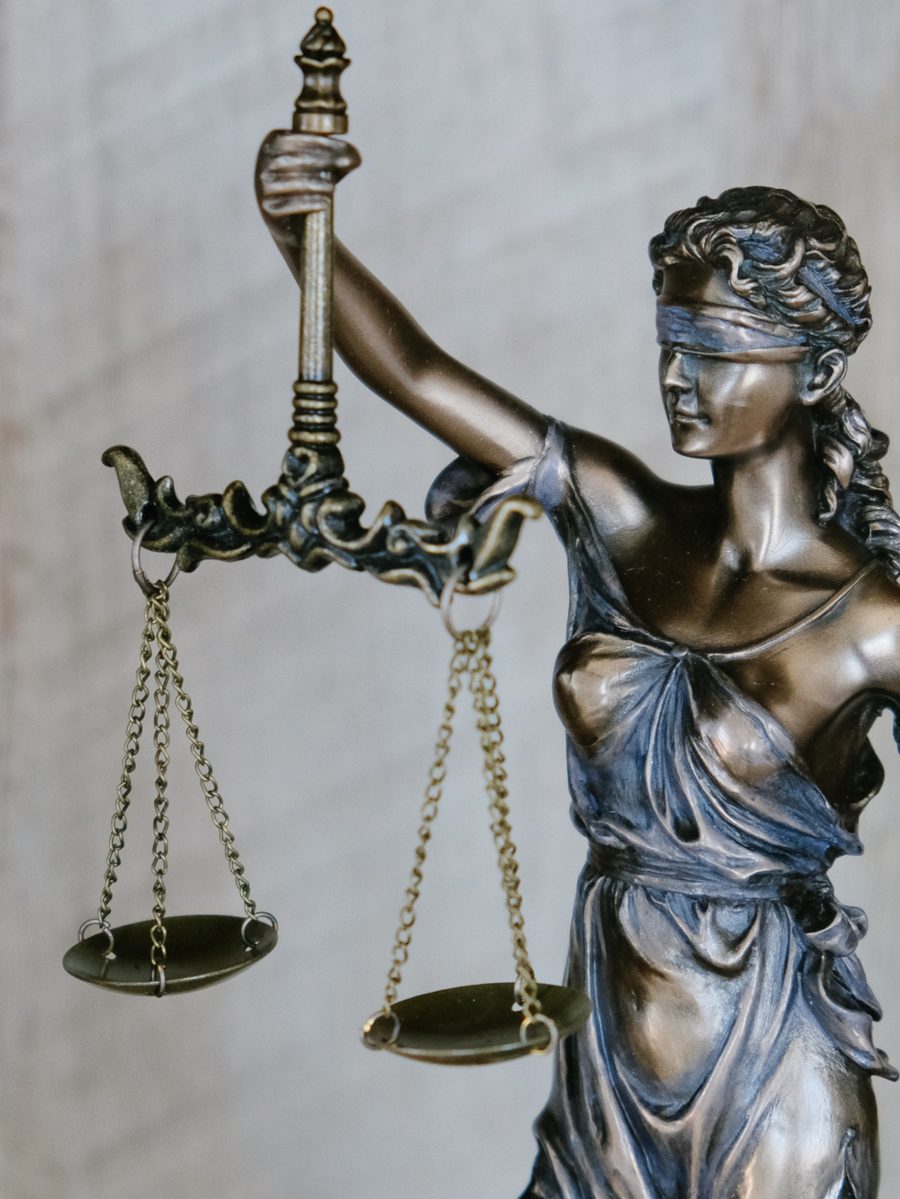 Bronze statue of Lady Justice holding scales